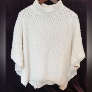 Cozy Off White Knit Ponch With A Roll Neck And Dolman Sleeves. Made In Italy